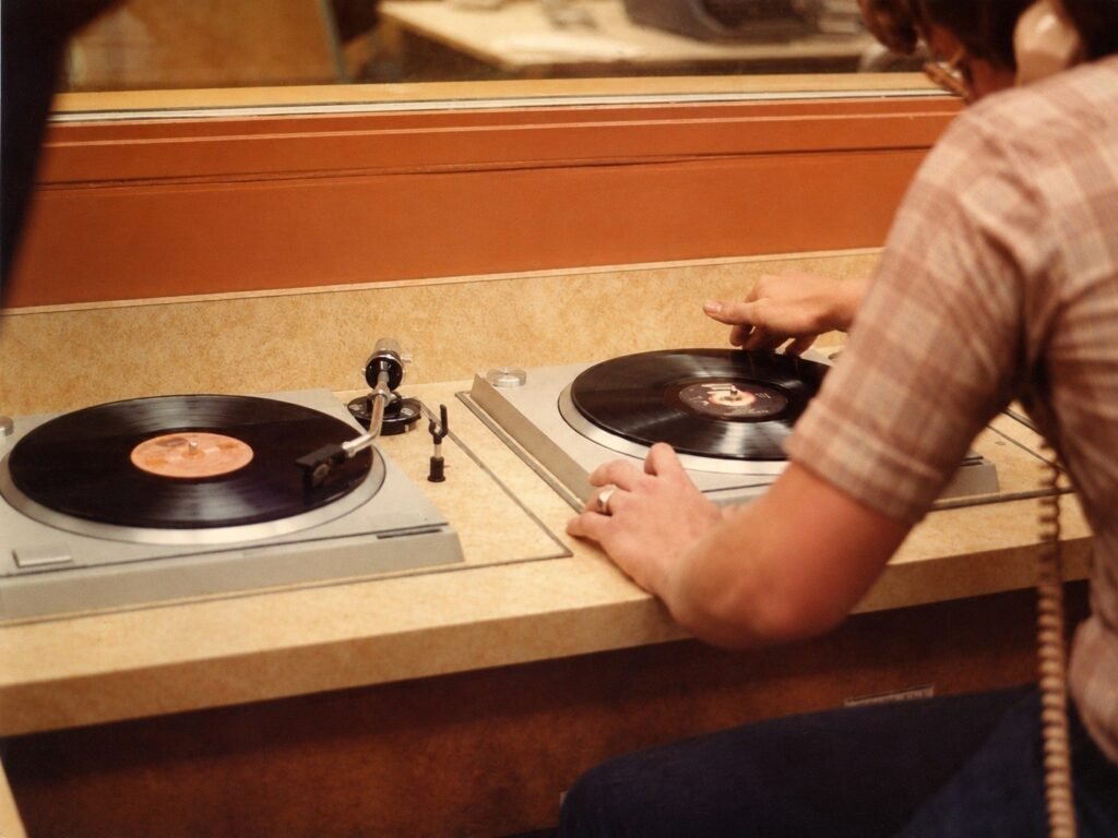 Two turntables in the KCPR radio studio with records being cued for air