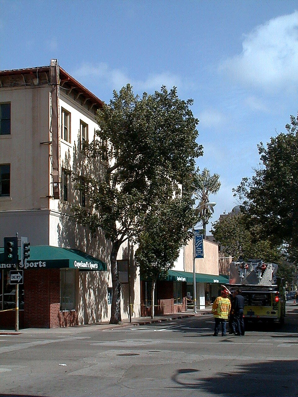 Firefighters beside the Wineman Hotel building at Higuera and Chorro, April 1999